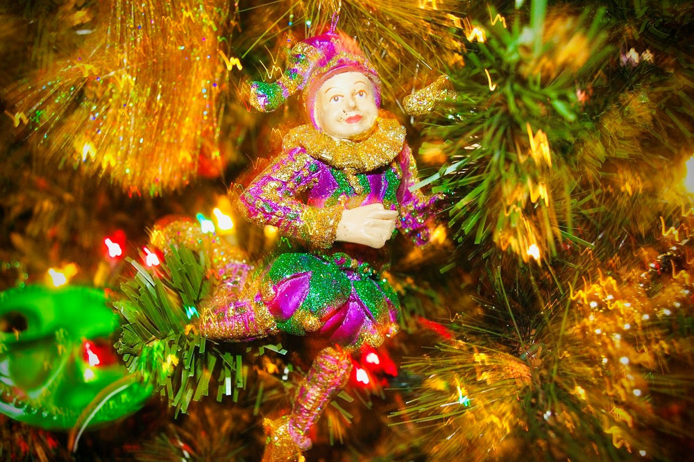Ornament of a Jester in Mardi Gras colors on a Christmas Tree on display for the holiday season in New Orleans