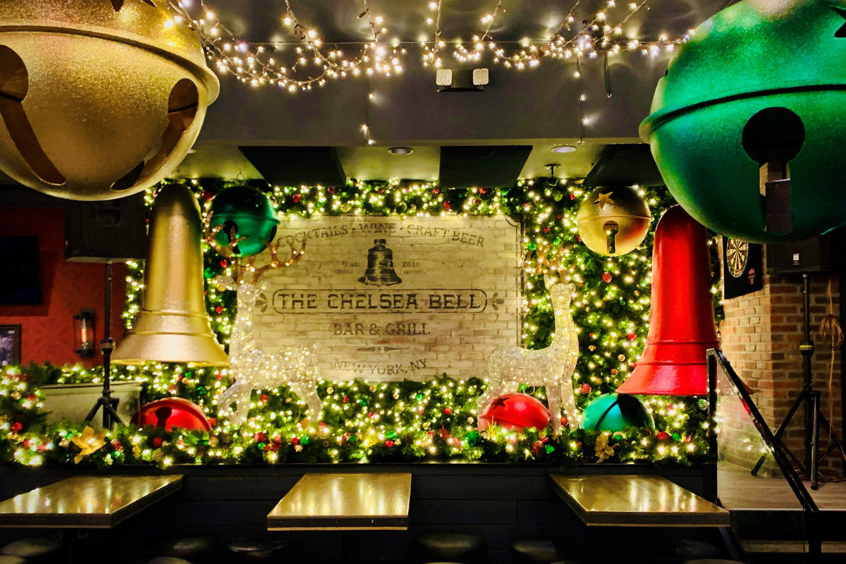 The Chelsea Bell in NYC features some of the best holiday decor for Christmas with oversized bells, greenery walls and reindeer