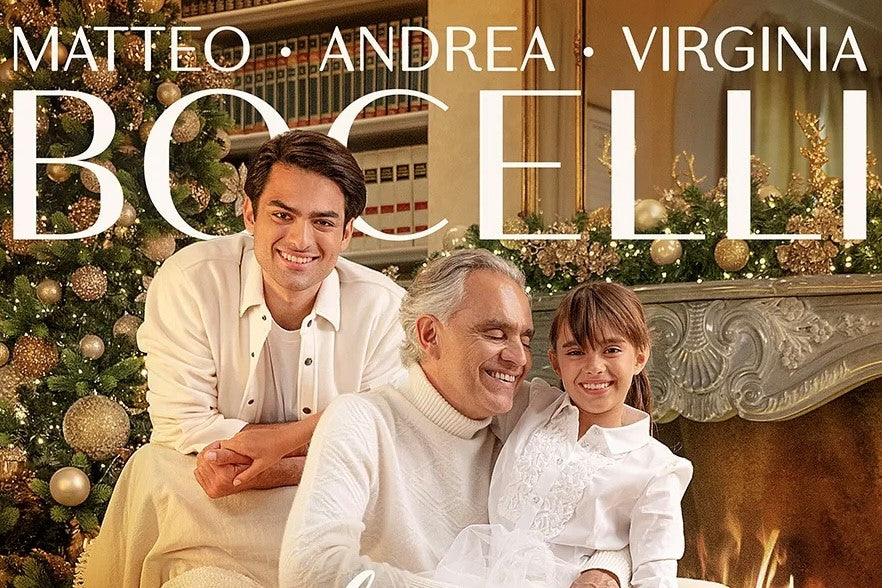Andrea Bocelli, Matteo Bocelli, Virginia Bocelli dresed in white in front of a Christmas tree on cover of holiday album "A Family Christmas"