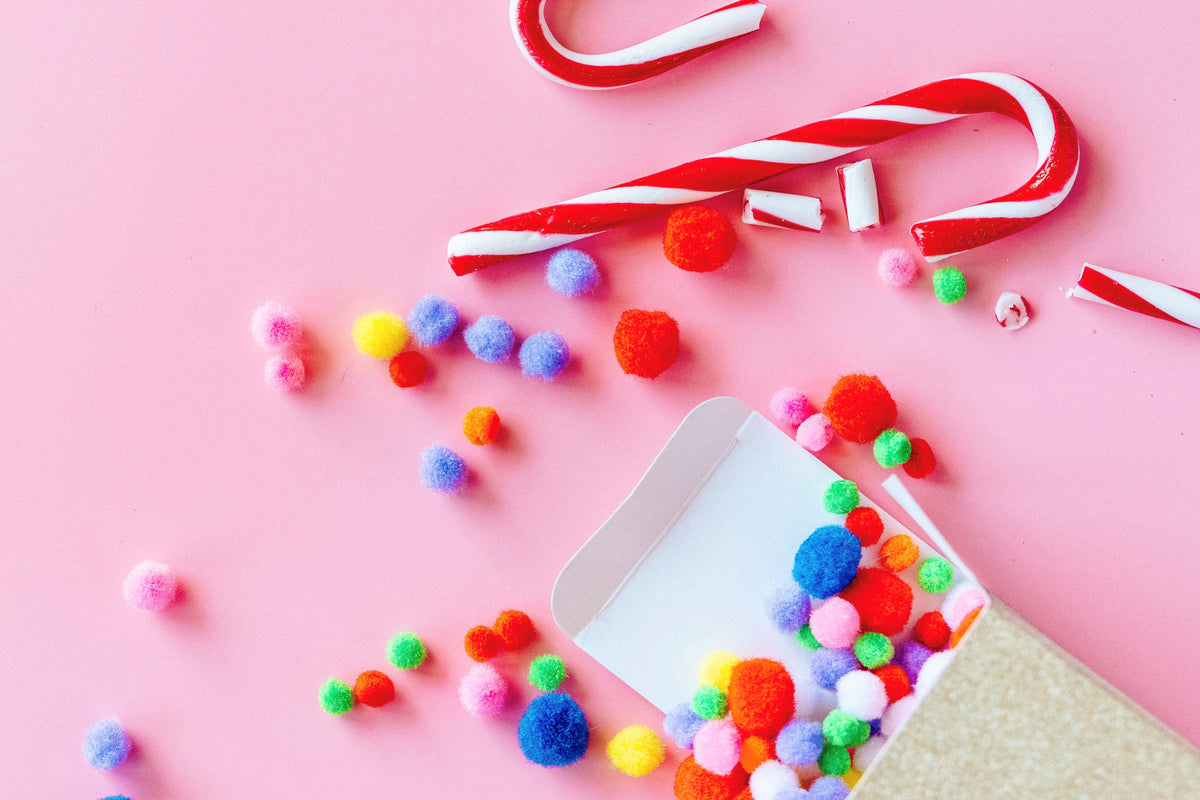 Candy Cane and pom poms for Christmas Candy Cane Favor Bags