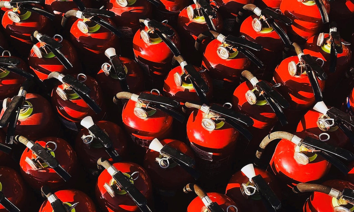 A lineup of fire extinguishers ready for holiday safety.