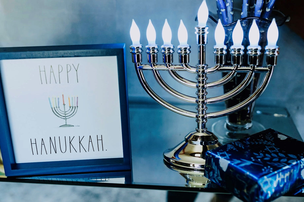A Menorah and sign wishing A Happy Hanukkah