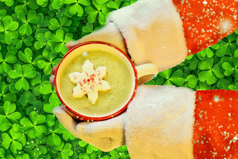 Lucky Elf Green Matcha Hoyt Chocolate being held by Santa over a table of shamrocks - St. Patrick's Day Christmas Holiday Recipe