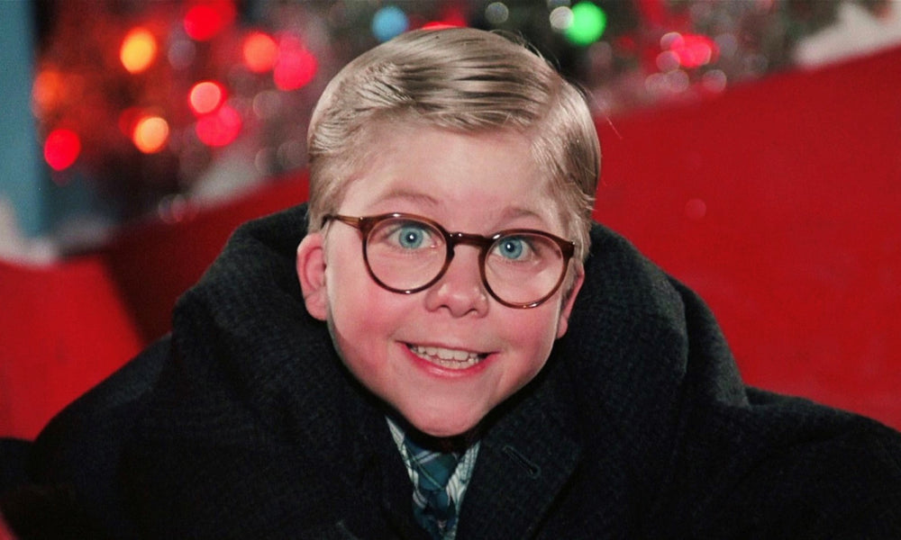 Peter Billingsley as Ralphie Parker Smiling on Red Slide after meeting Santa Claus in the beloved holiday classic Christmas movie, A Christmas Story